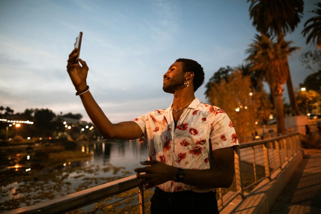 Man Taking a Selfie at a Park